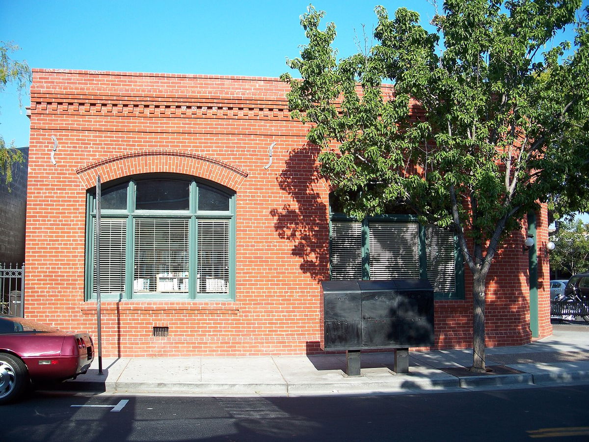 The red-brick Bank of Campbell building with its arched window